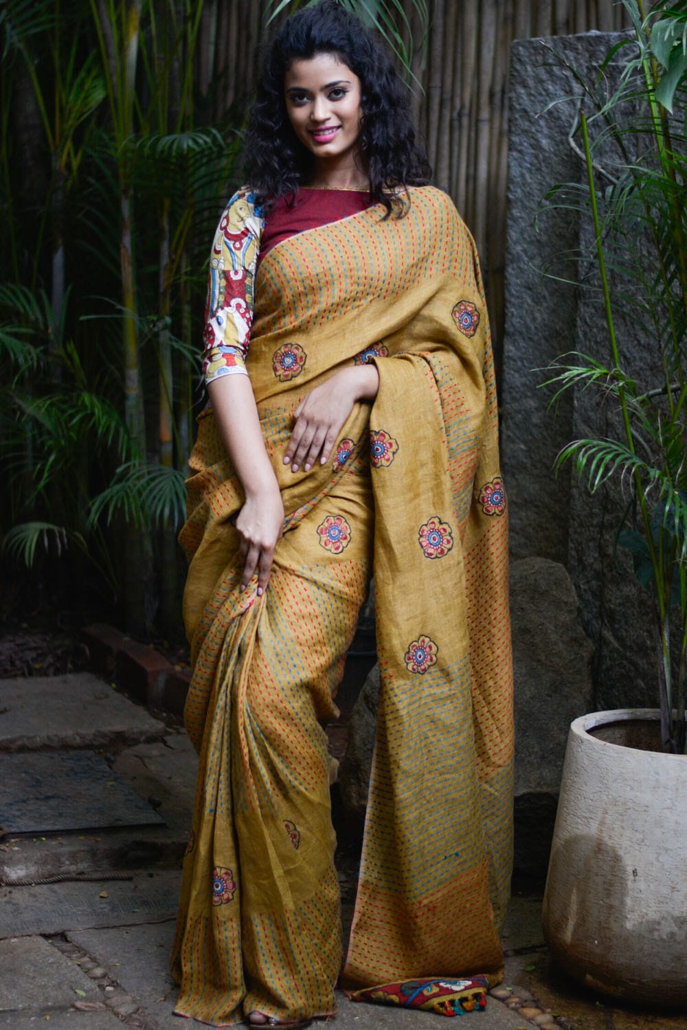 Mustard multicolour back stitch handwoven linen saree with floral kalamkari applique