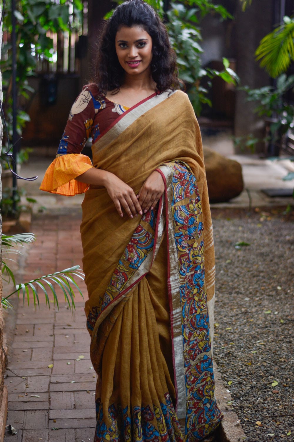 Brown Handwoven linen saree with silver border and Kalamkari applique