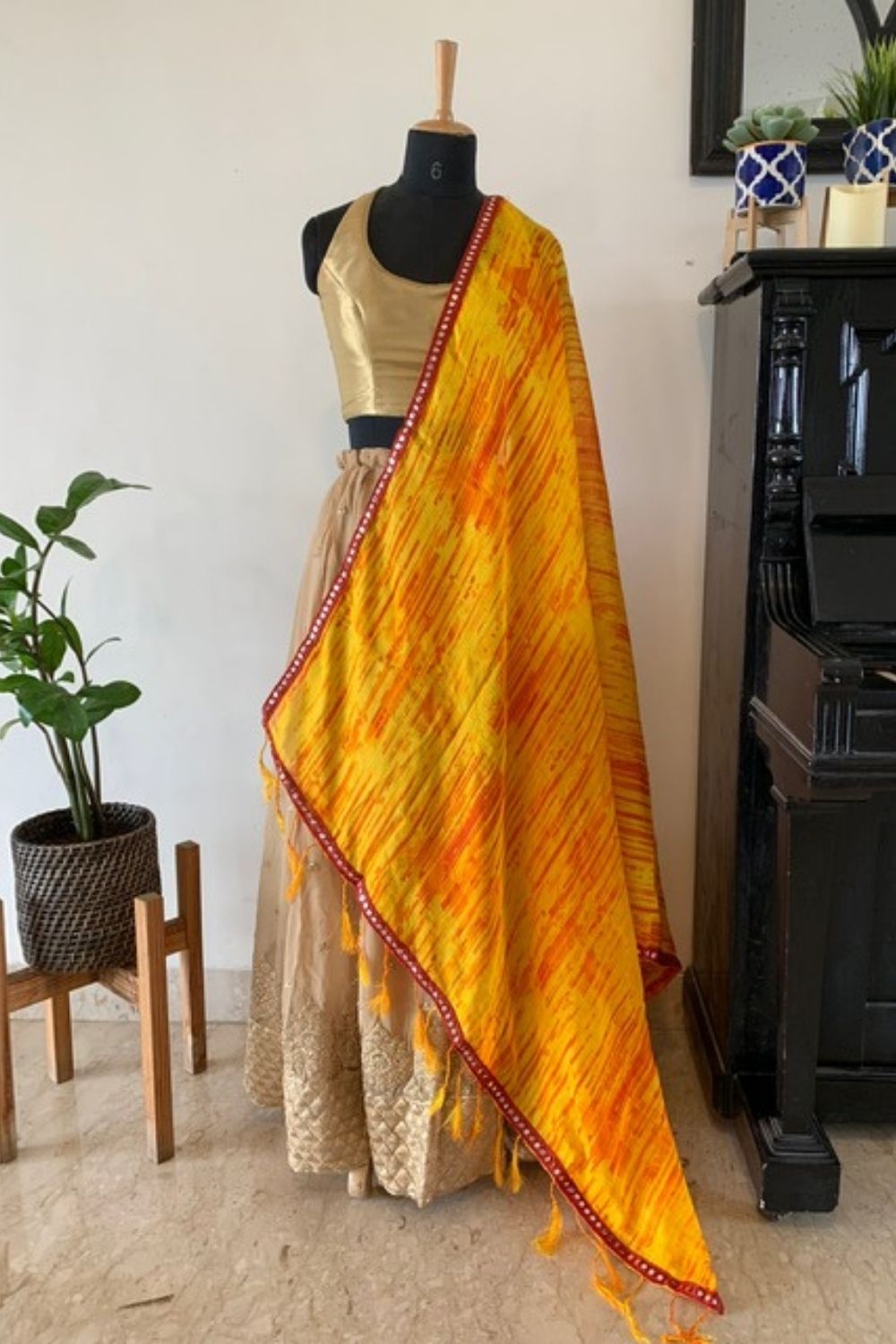 Yellow and orange shibori shaded Kota dupatta with maroon mirrorwork border