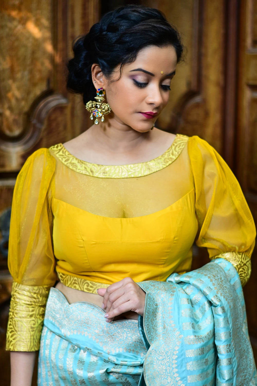 Yellowish mustard silk boat neck blouse with sheer yoke