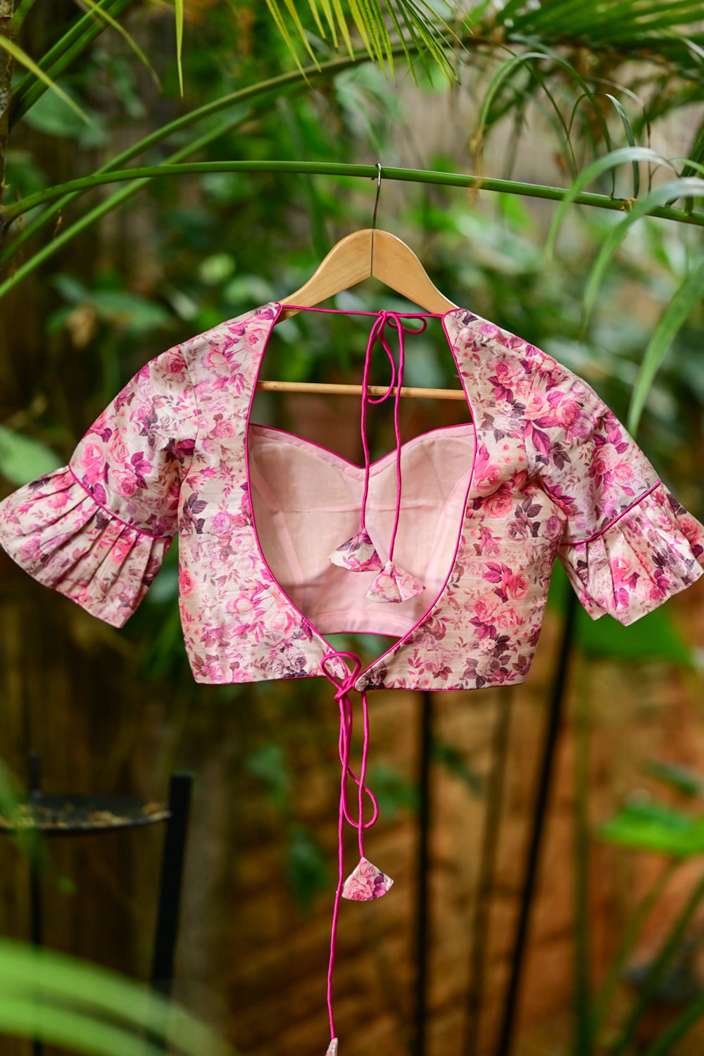 Light pink floral  semi raw silk sweetheart neck blouse with ruffled sleeves.