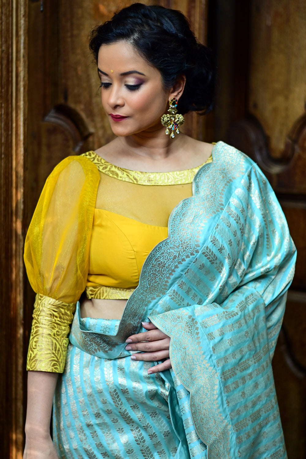 Yellowish mustard silk boat neck blouse with sheer yoke