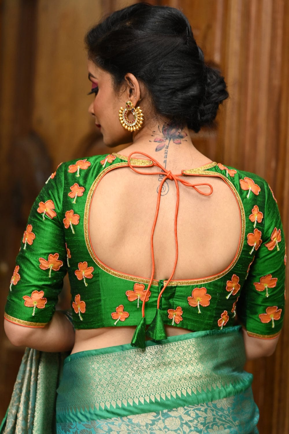 Green raw silk close neck blouse with hand painted and embroidered kanakambaram