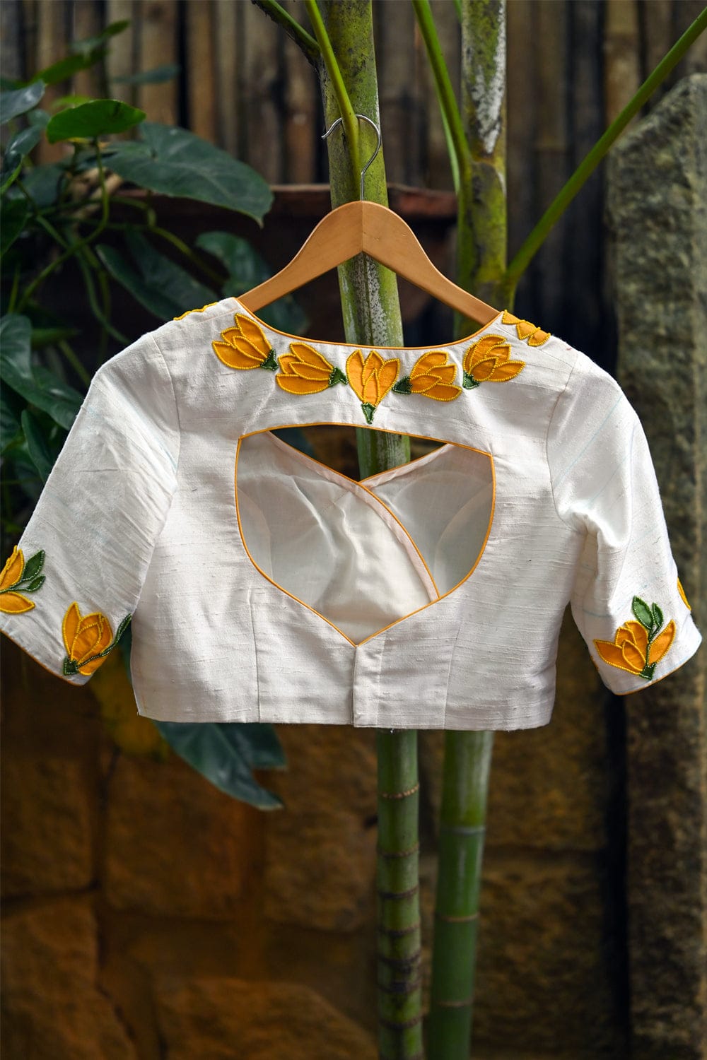 Off white raw silk U neck blouse with hand painted and embroidered sampige poovu