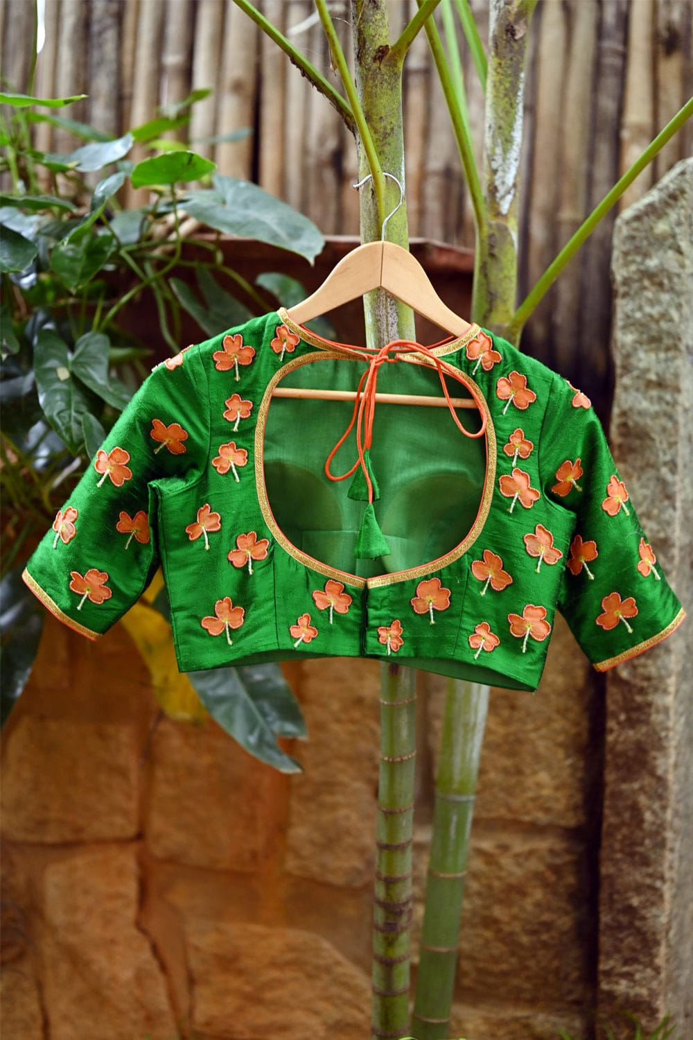 Green raw silk close neck blouse with hand painted and embroidered kanakambaram