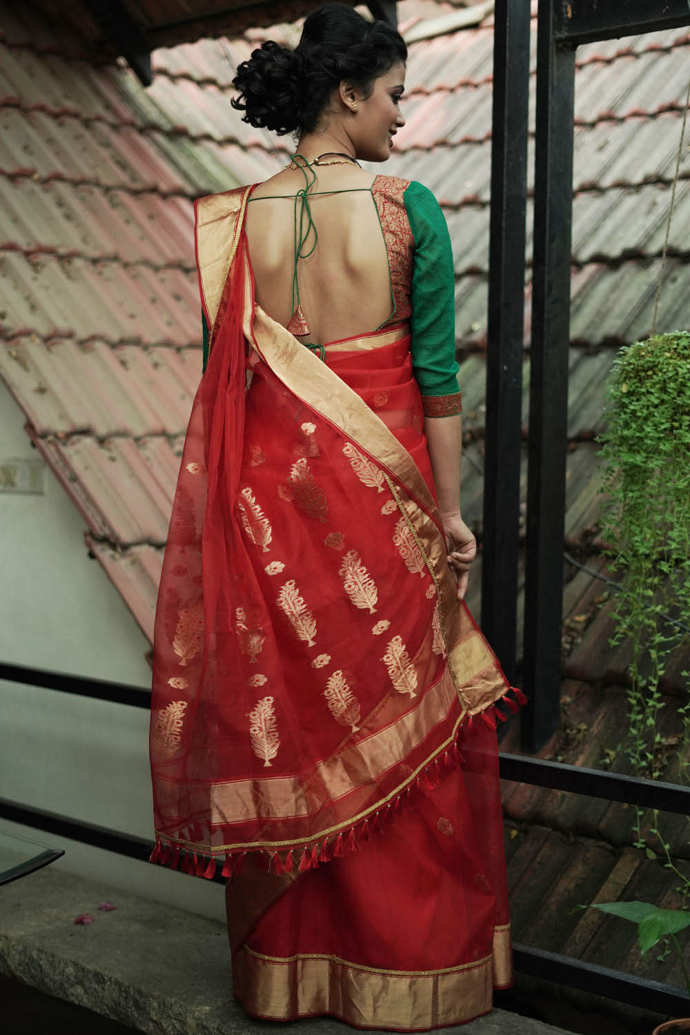 Ruby red chanderi with gold zari buttis and gold tissue border with gold lace.