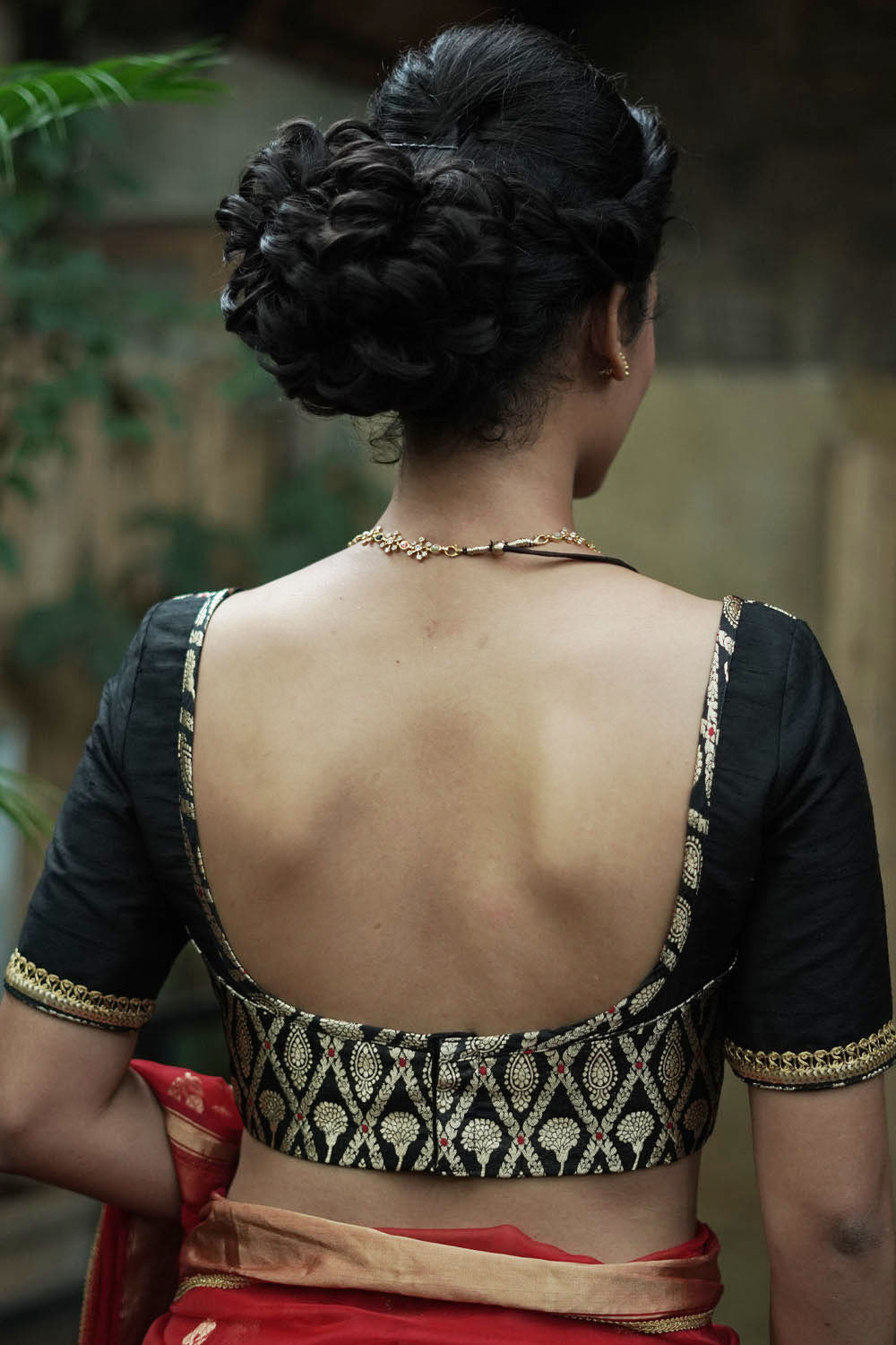Black raw silk U neck blouse with black and gold brocade band
