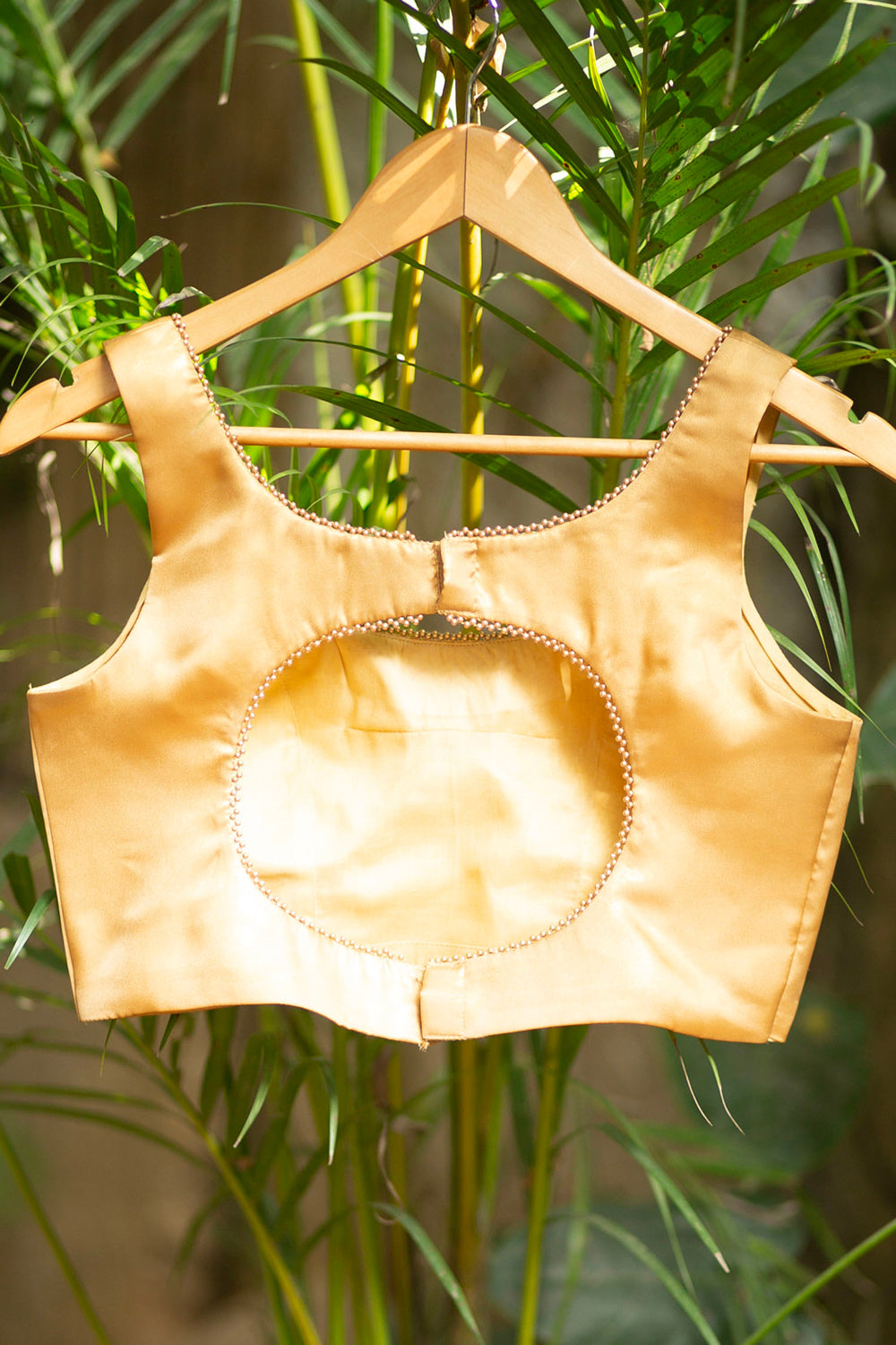 Gold shimmer satin U neck blouse with bead detailing