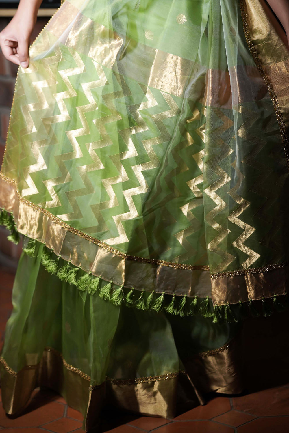 Pale green chanderi saree with gold zari buttis and gold tissue with lace border