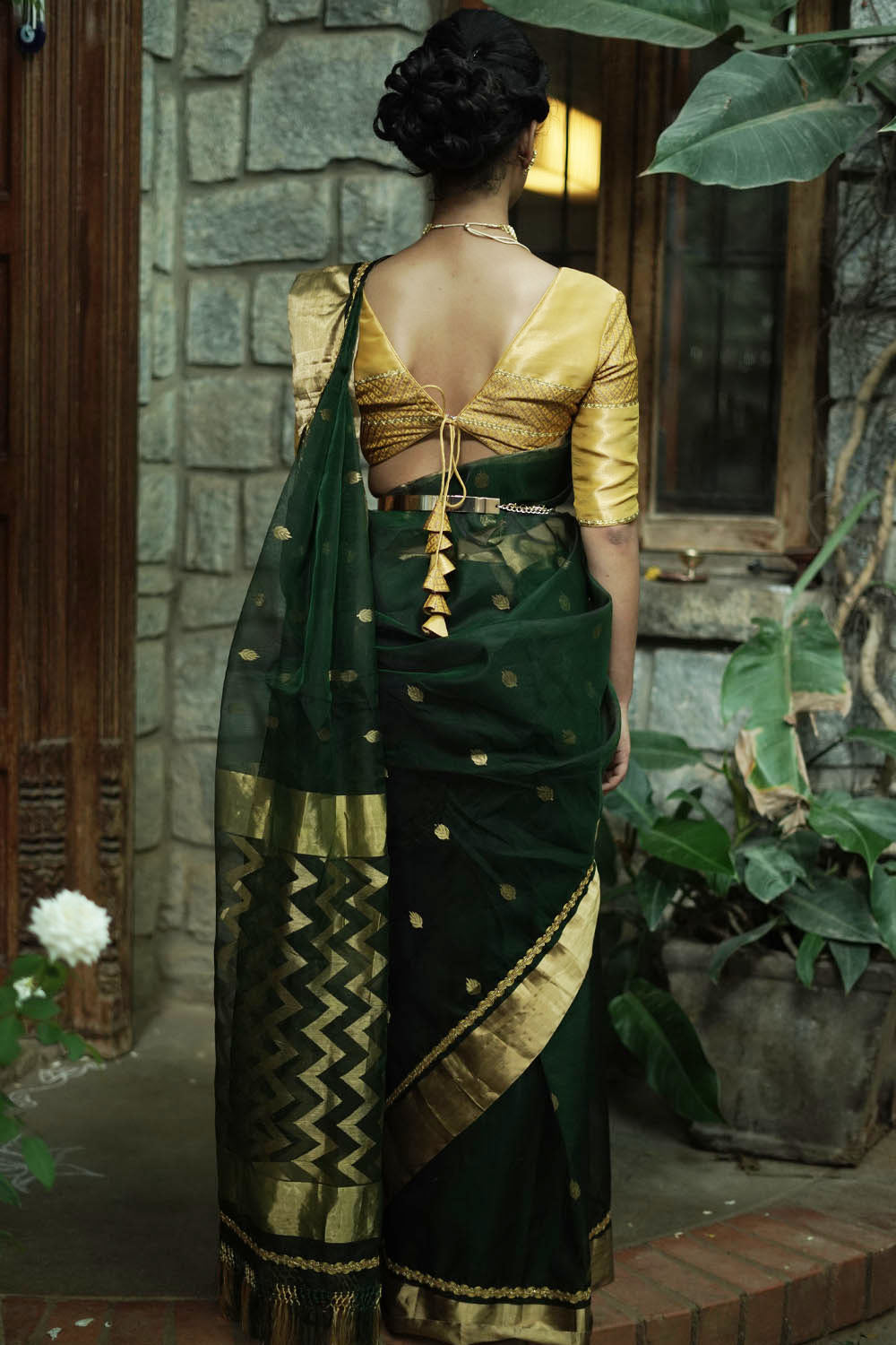 Bottle green chanderi saree with gold zari buttis and gold tissue border with gold lace.