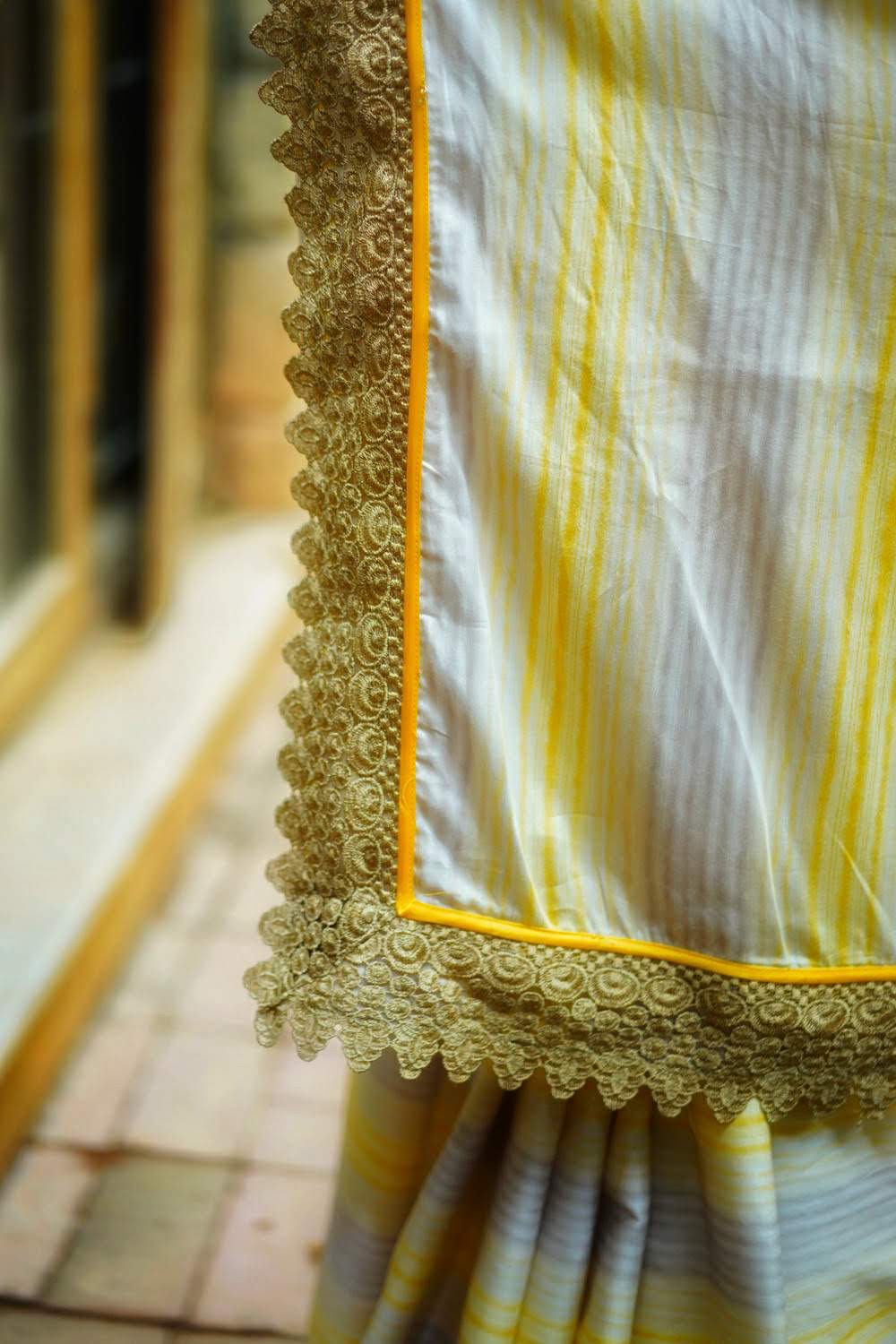 Off white and yellow stripes cotton saree with gold lace border - House of Blouse