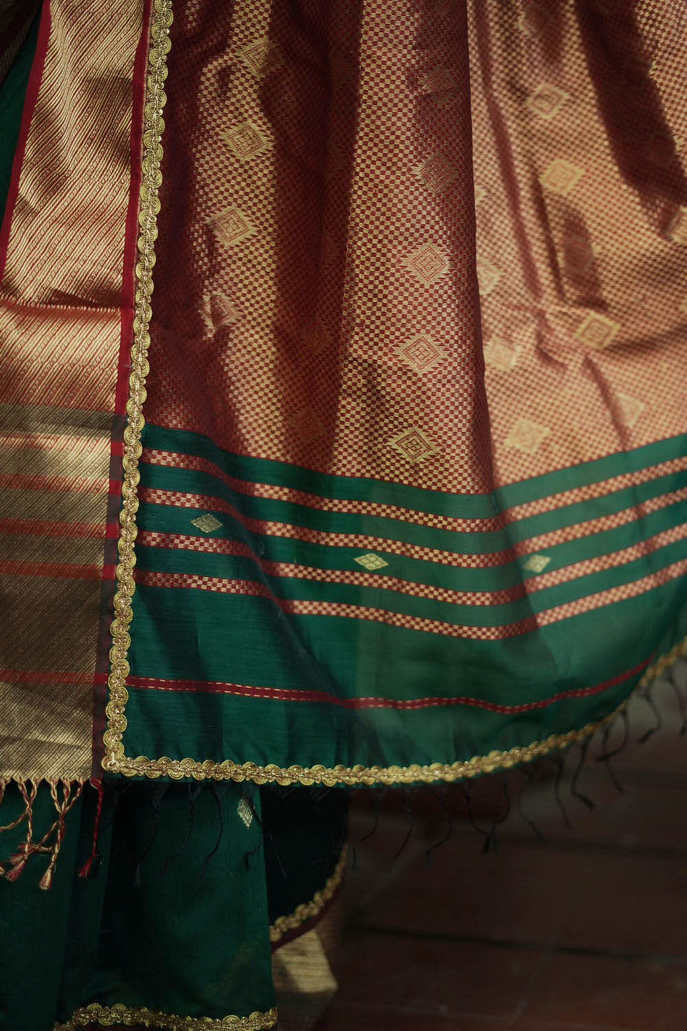 Pine green maheshwari silk saree with lace and gold border