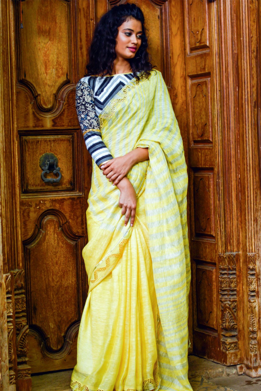 Lemon yellow handwoven linen silver stripes saree with cutwork border and cutwork pallu