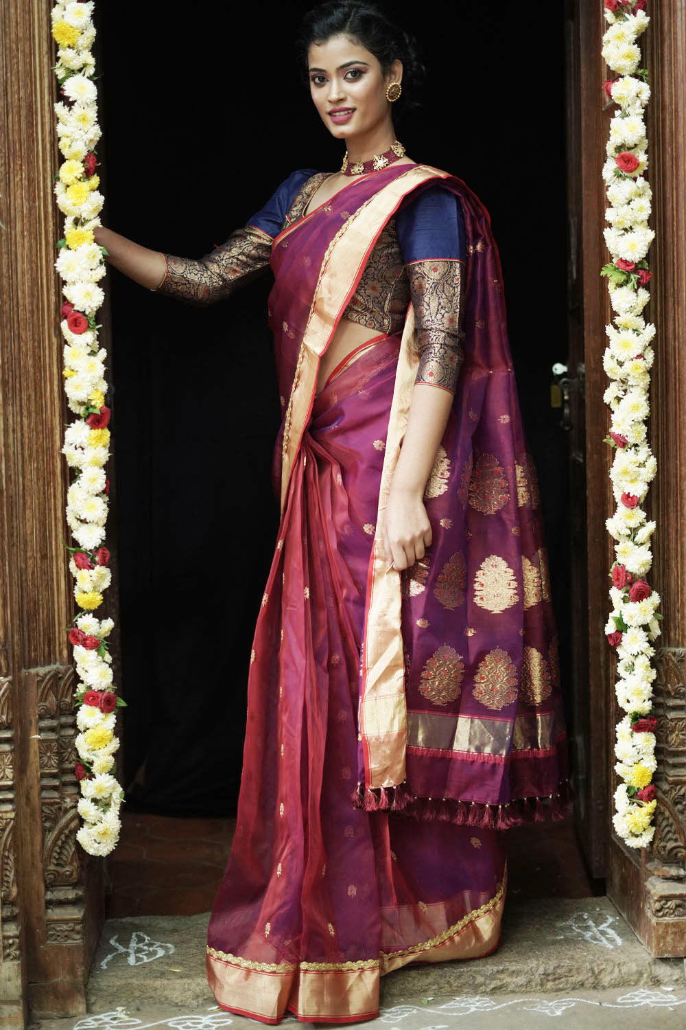 Plum coloured pure chanderi saree with gold zari buttis and gold tissue border with gold lace.