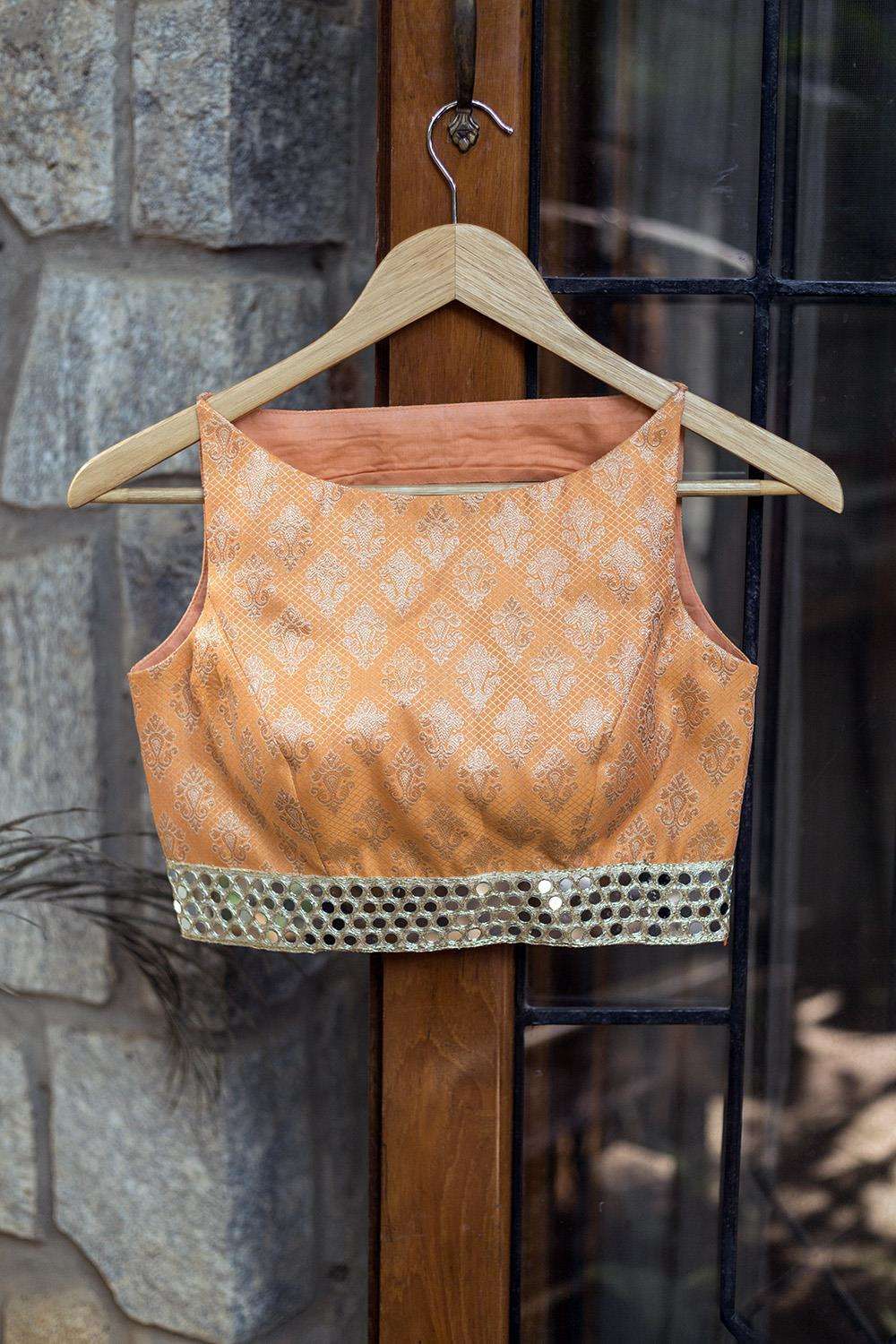 Apricot orange brocade boatneck blouse with mirror work border - House of Blouse