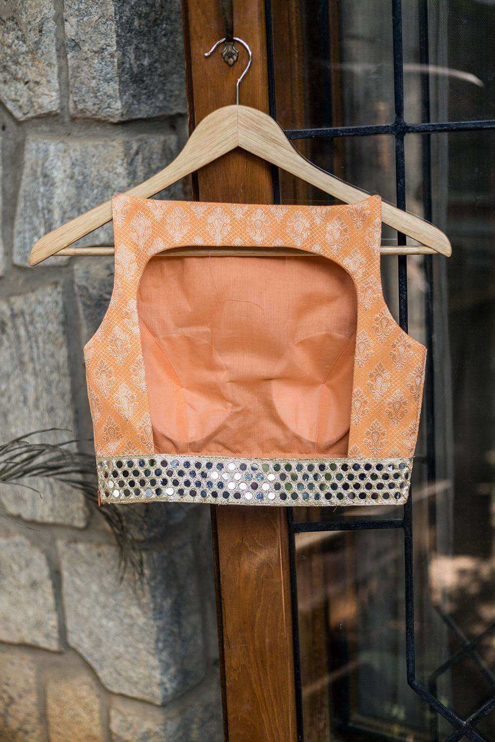 Apricot orange brocade boatneck blouse with mirror work border - House of Blouse