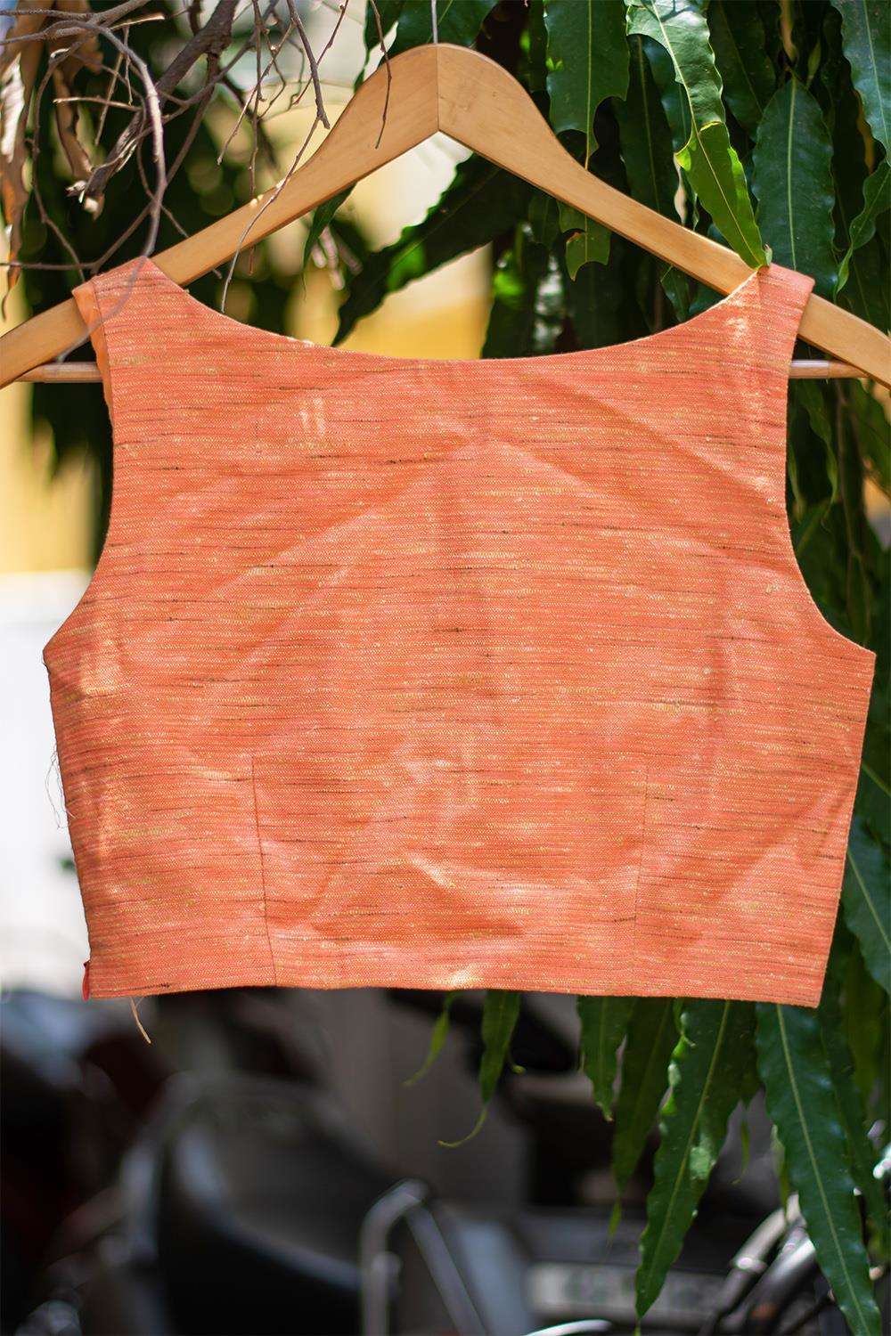 Apricot orange jute tussar boatneck sleeveless blouse with cut out at neck - House of Blouse