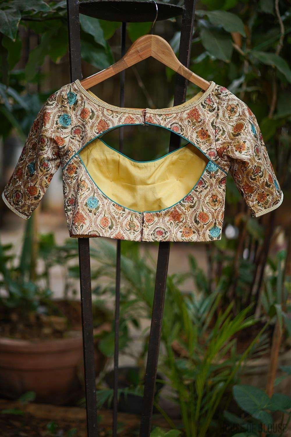 Cream and muticolour printed Hakoba boatneck blouse with cut out detailing - House of Blouse