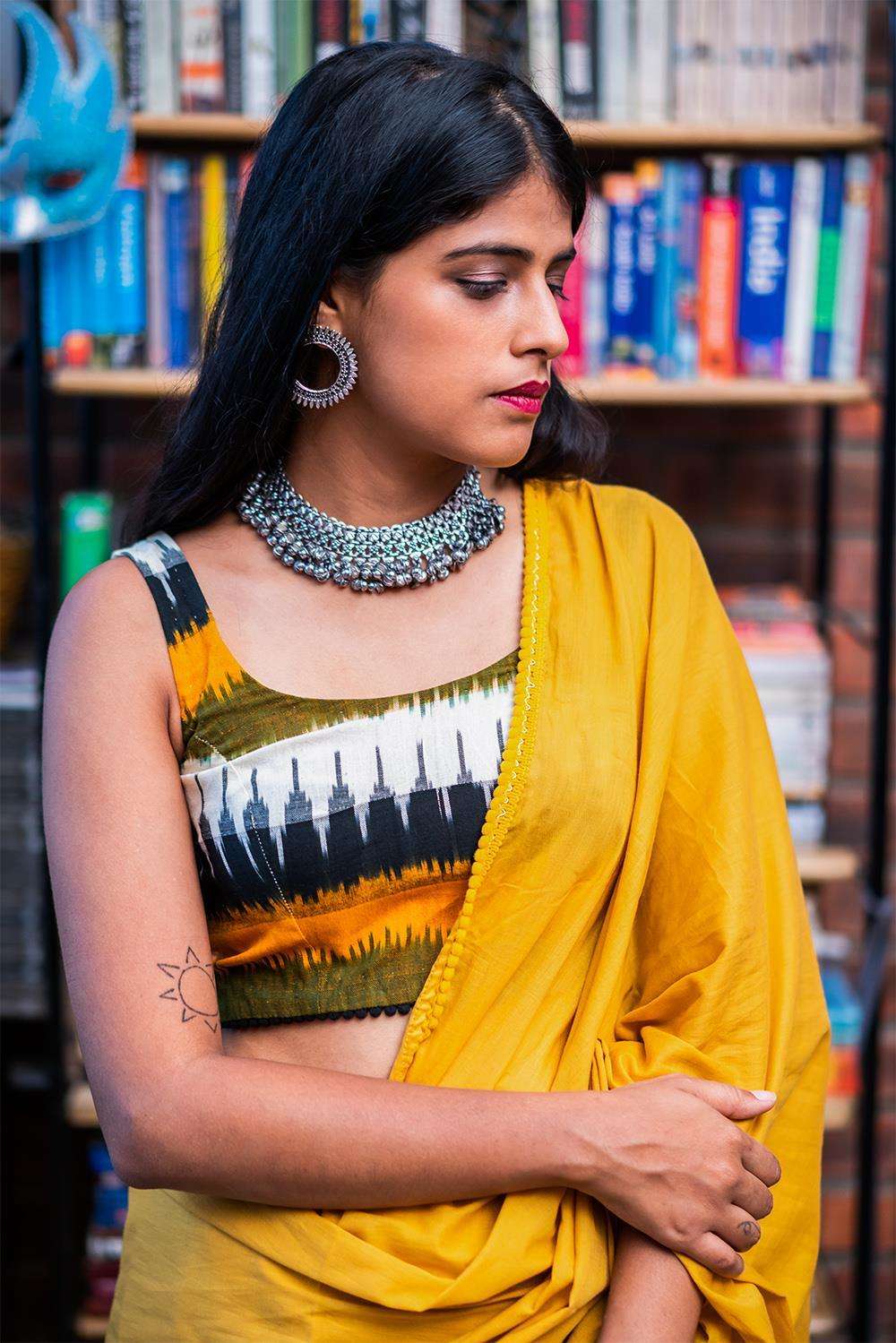 Mustard, green and black Ikat cotton sleeveless blouse with black pom pom edging - House of Blouse