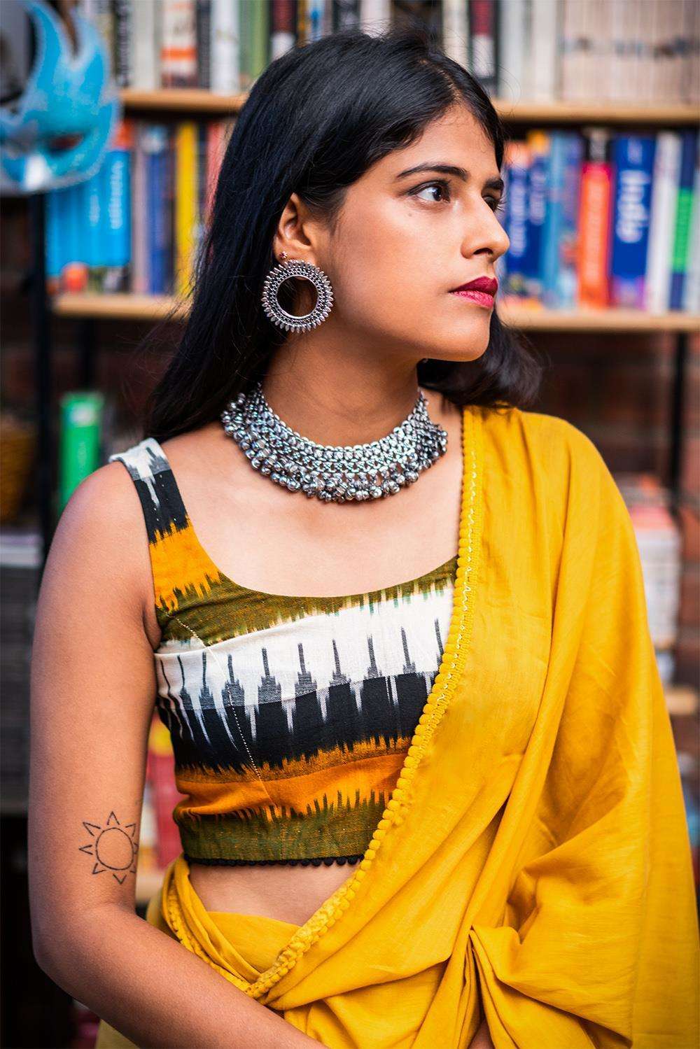 Mustard, green and black Ikat cotton sleeveless blouse with black pom pom edging - House of Blouse