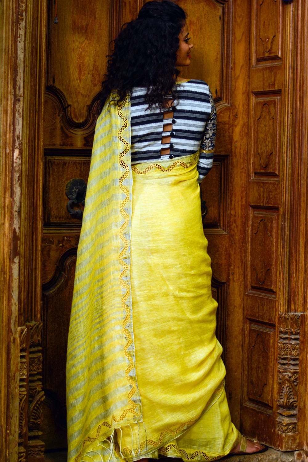 Lemon yellow handwoven linen silver stripes saree with cutwork border and cutwork pallu