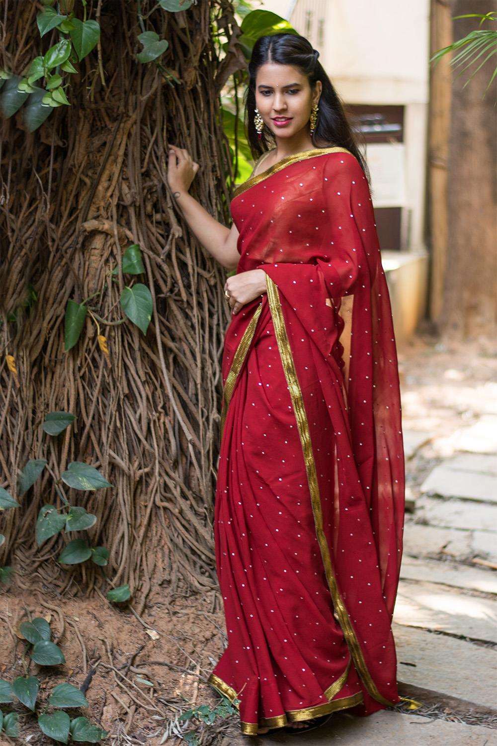 Deep red georgette saree with stone work and antique crushed gota border